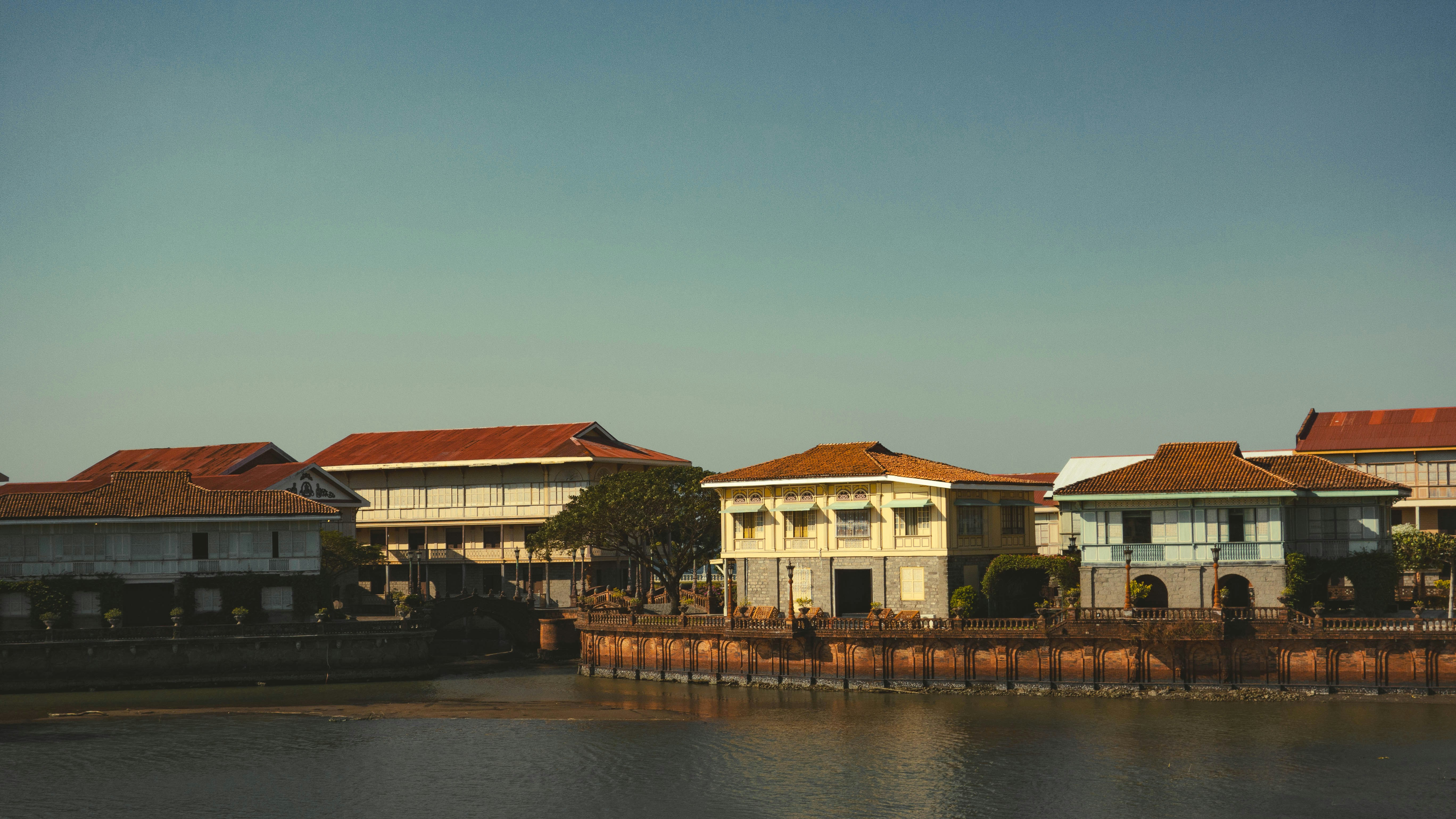a body of water with buildings in the background