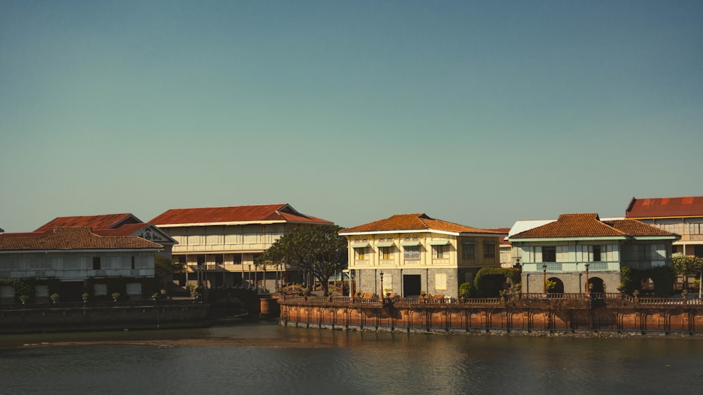 a body of water with buildings in the background