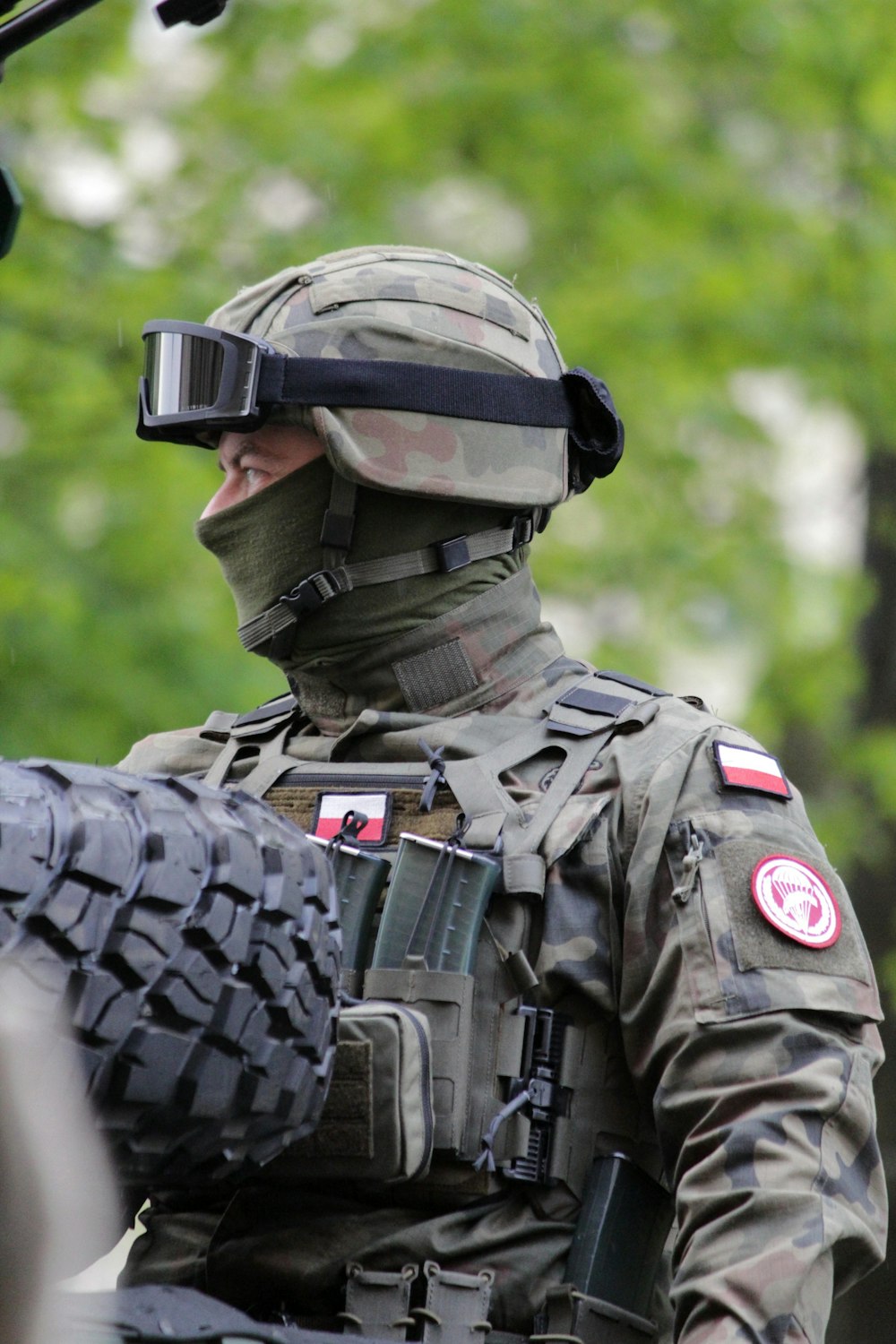 a man in a military uniform with a helmet and goggles on