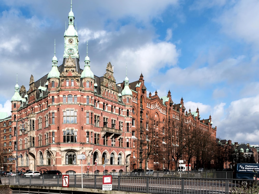 a large red brick building with a clock tower