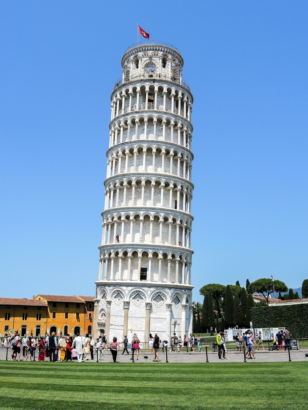 a tall tower with a flag on top of it