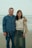a man standing next to a woman on a beach