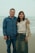 a man standing next to a woman on a beach