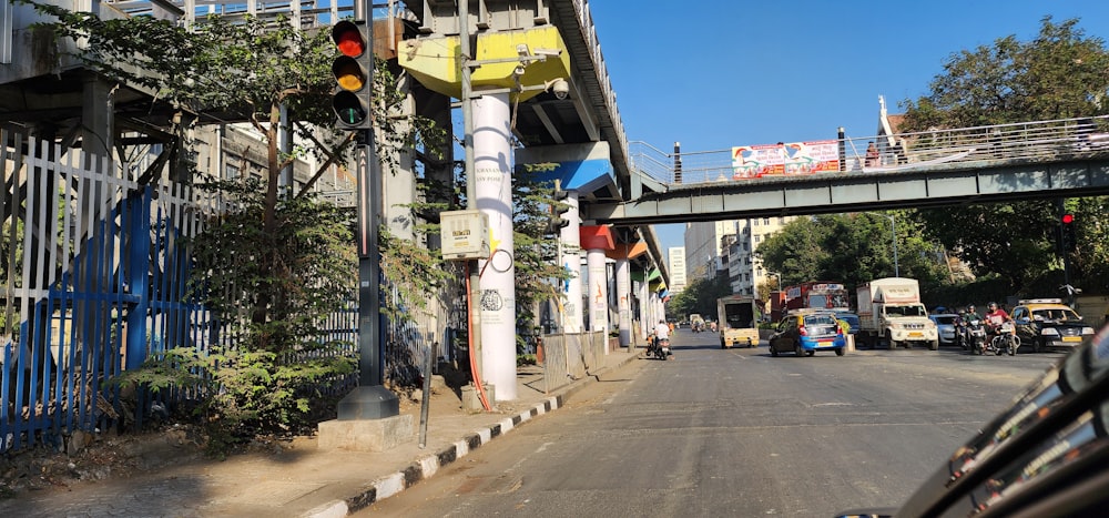 a city street with a bridge over it