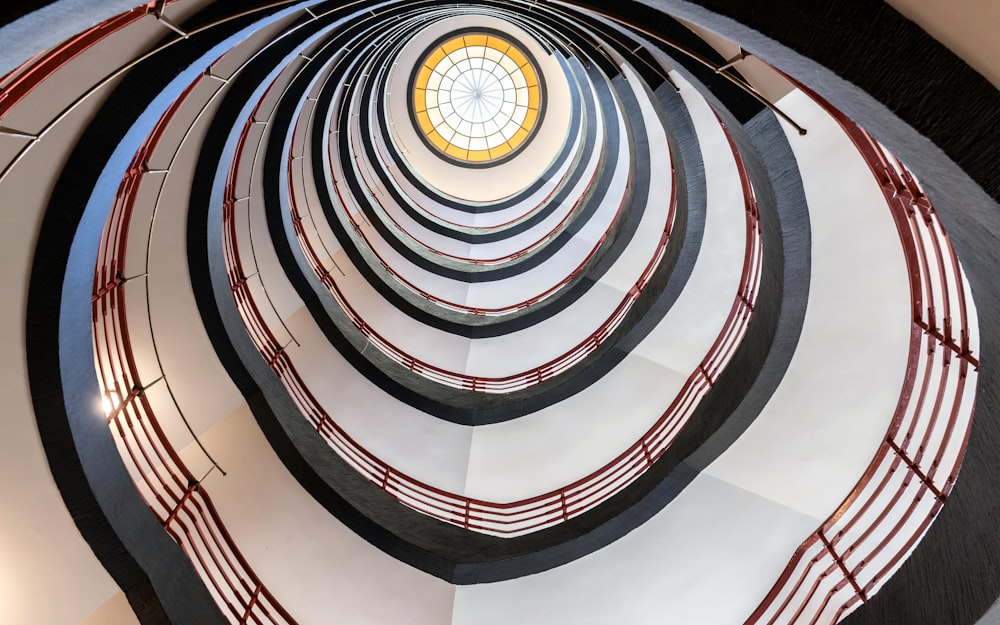 a spiral staircase with a circular window in the center