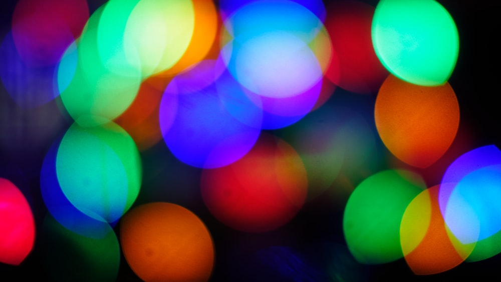 a blurry photo of multi colored lights