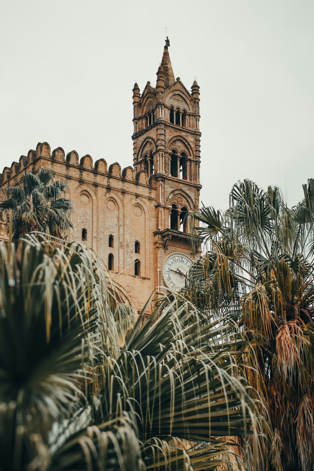 a very tall building with a clock on it's side