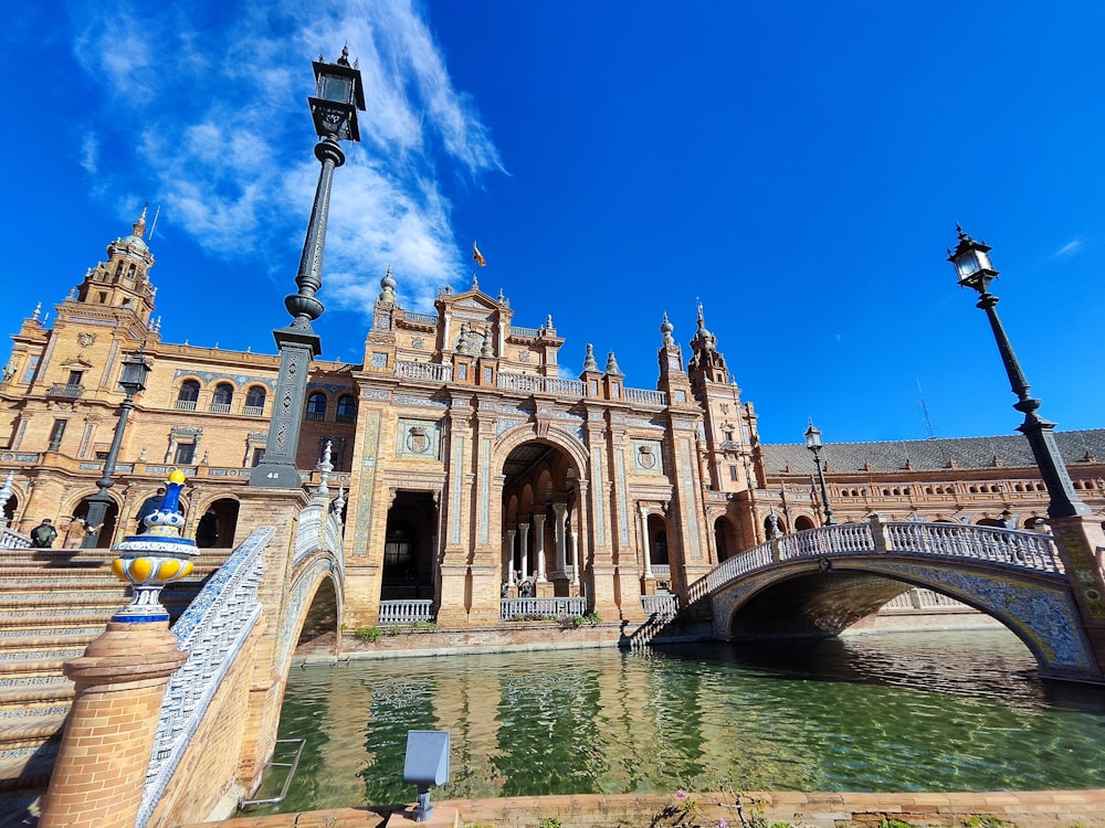 a bridge over a body of water in front of a building