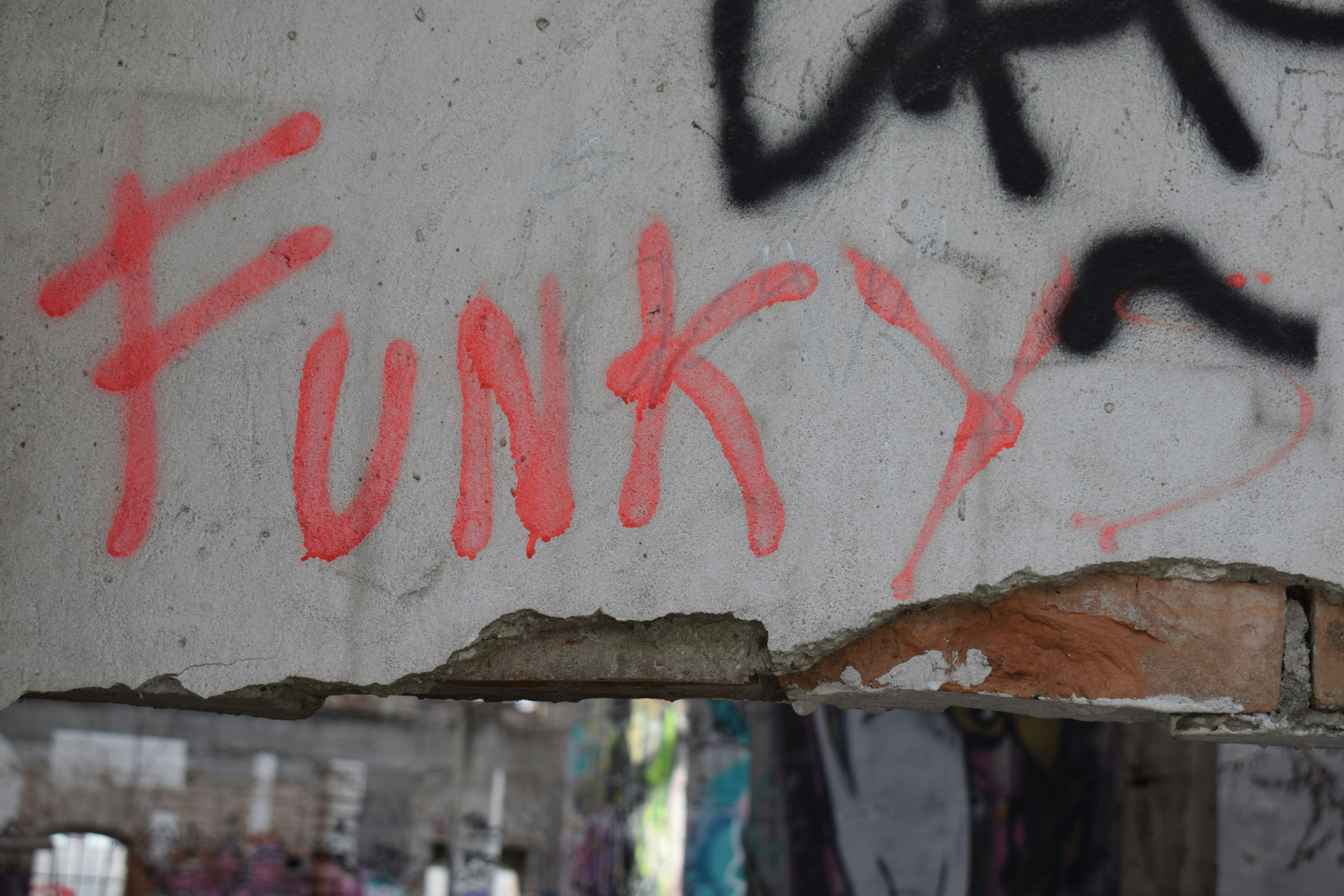 a wall that has some graffiti on it