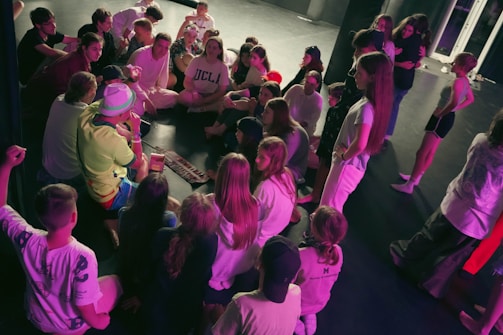a group of people standing around a table