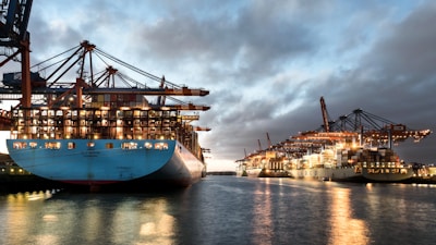 a large blue boat sitting in the middle of a body of water