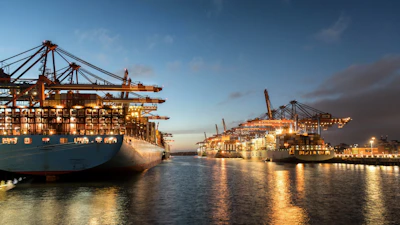 a large ship is docked at a dock