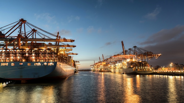a large ship is docked at a dock
