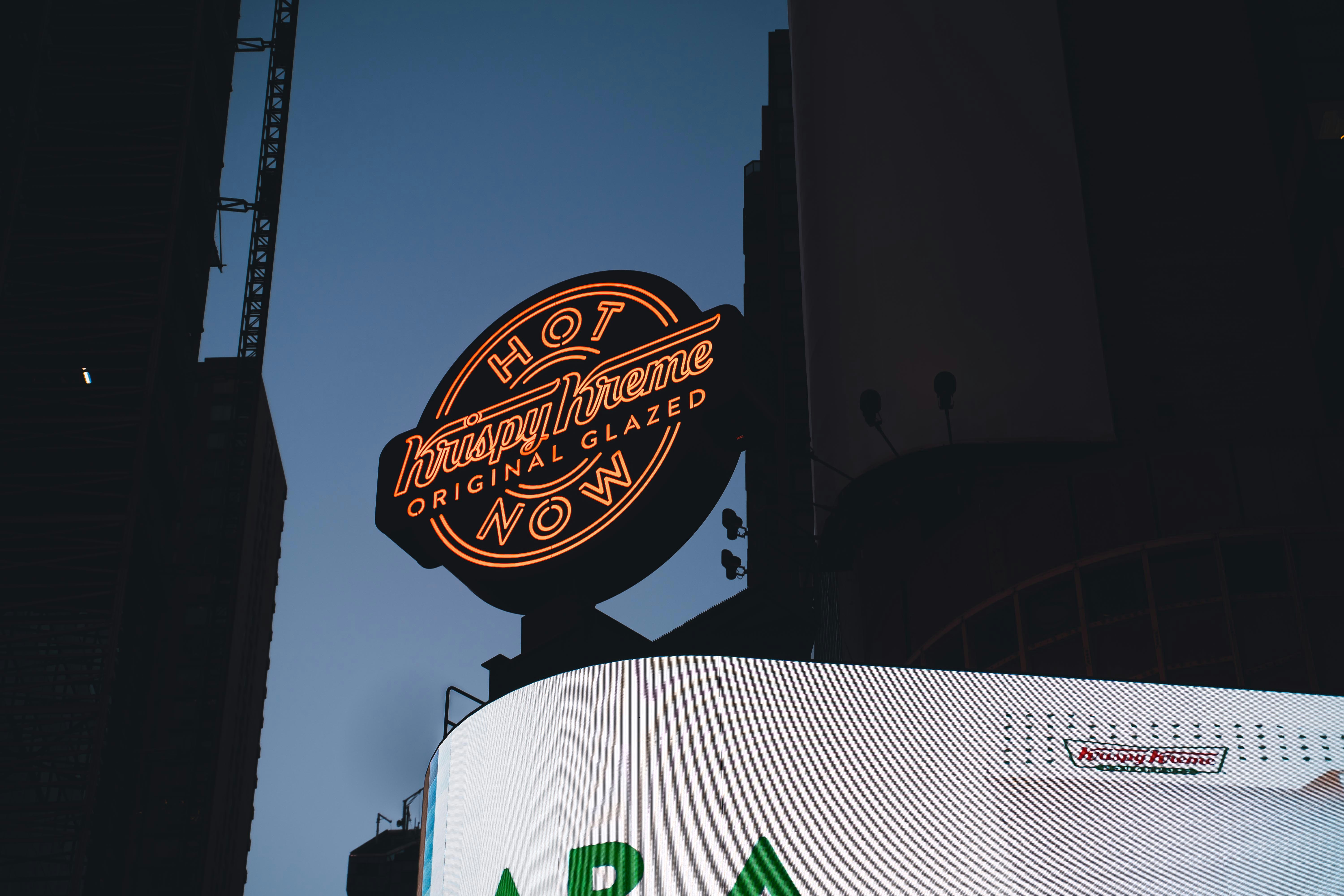 a large neon sign on the side of a building