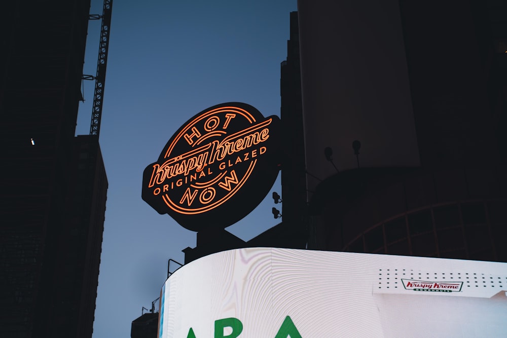 a large neon sign on the side of a building