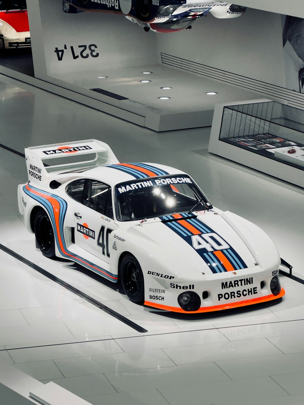 a model of a porsche racing car on display