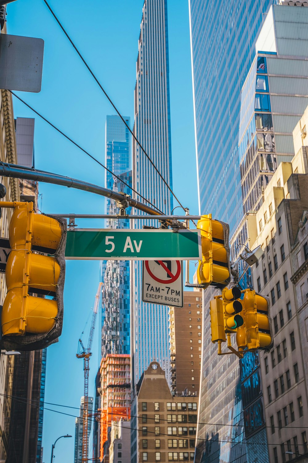 a street sign hanging from the side of a traffic light