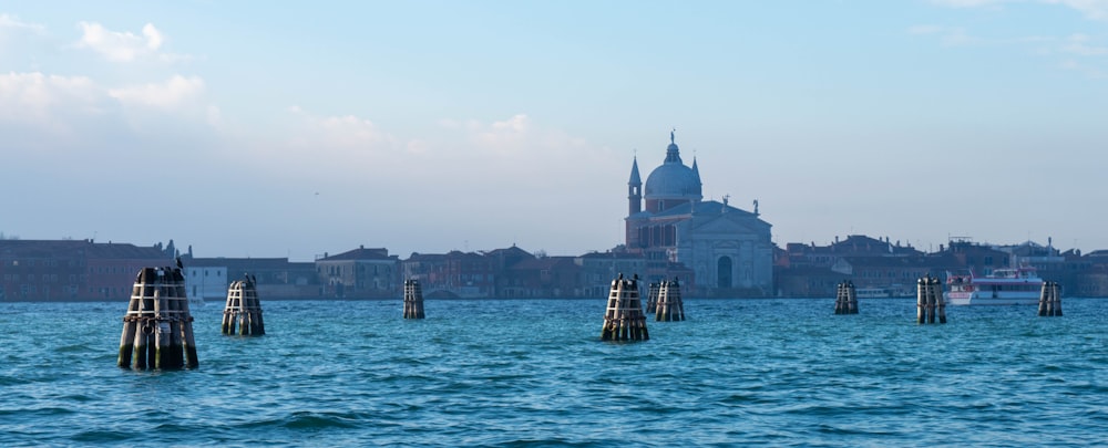 a large body of water with a city in the background