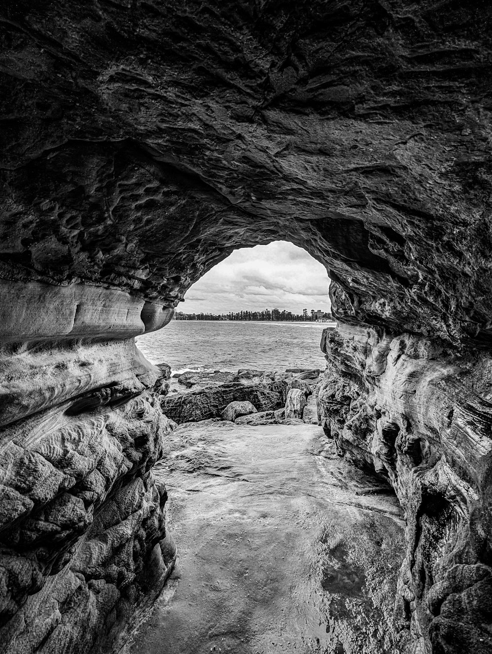 a black and white photo of a cave