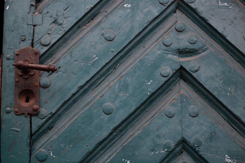 a close up of a metal door with a lock