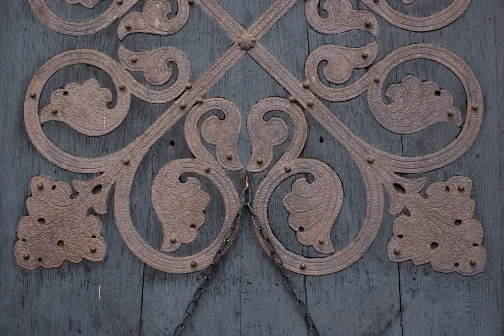 a close up of a wooden surface with a design on it