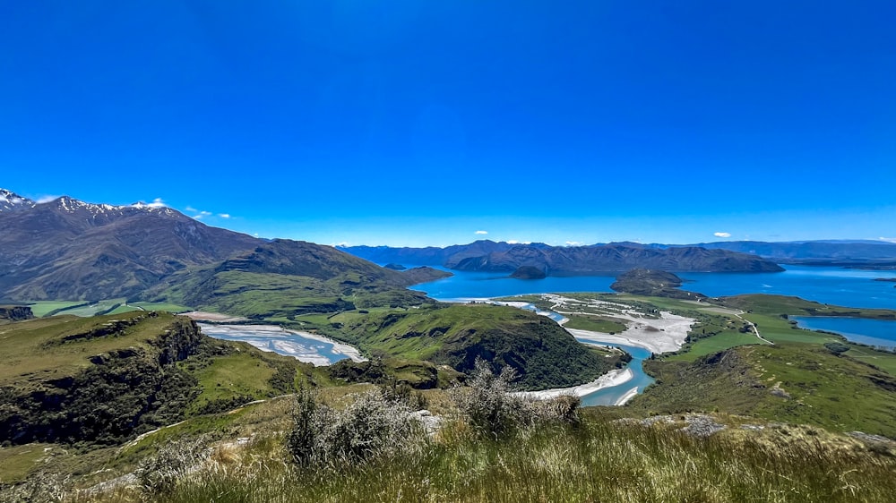 a scenic view of a lake and mountains