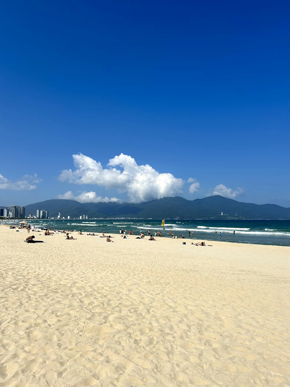 a beach with a lot of people on it