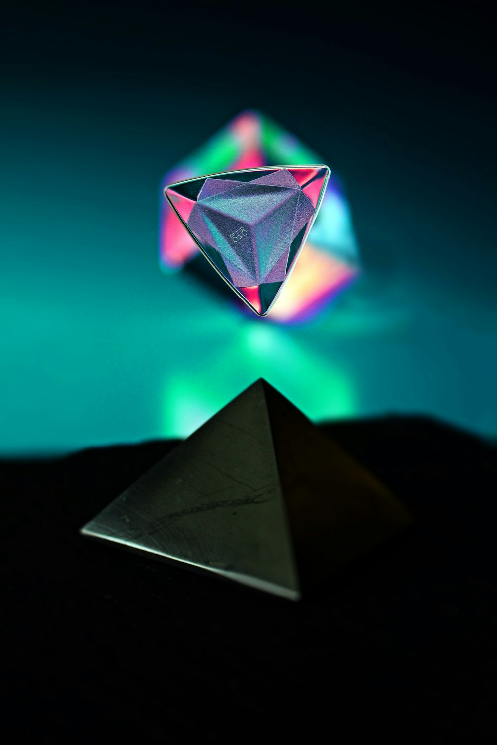 a diamond sitting on top of a pyramid