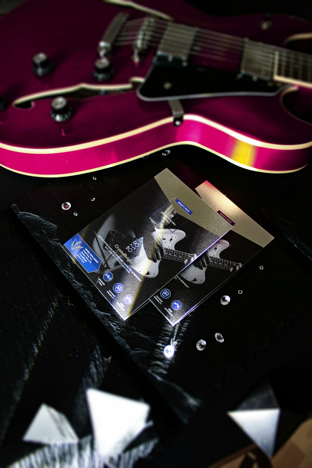 a purple guitar with a picture of a man on it
