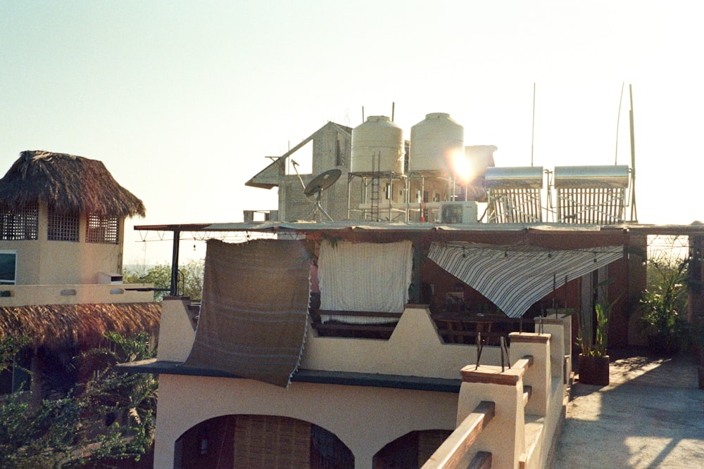 a house with a thatched roof and a hot tub