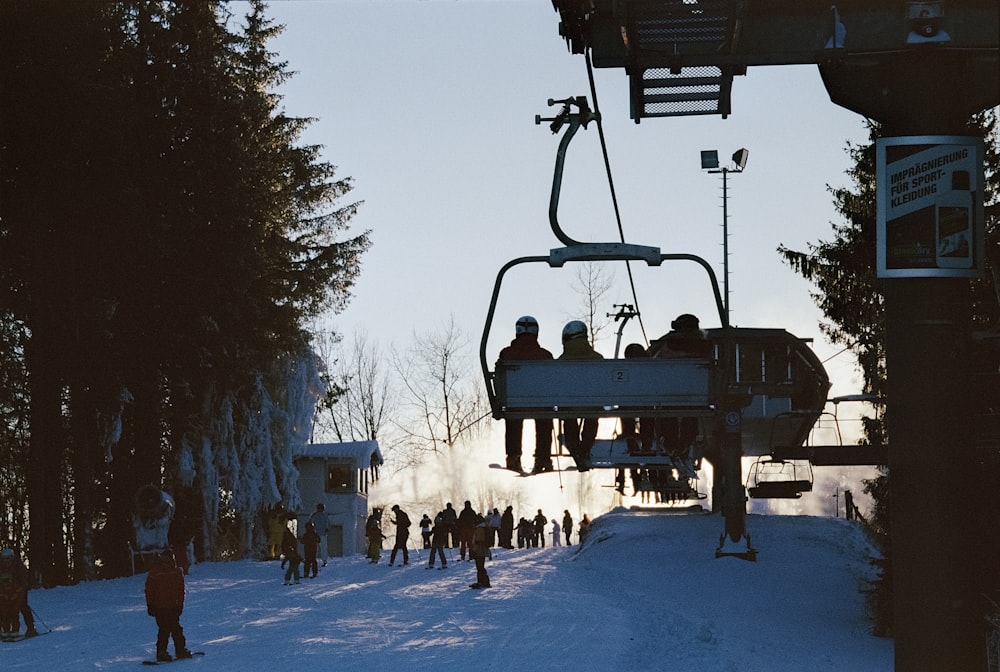 a group of people riding a ski lift