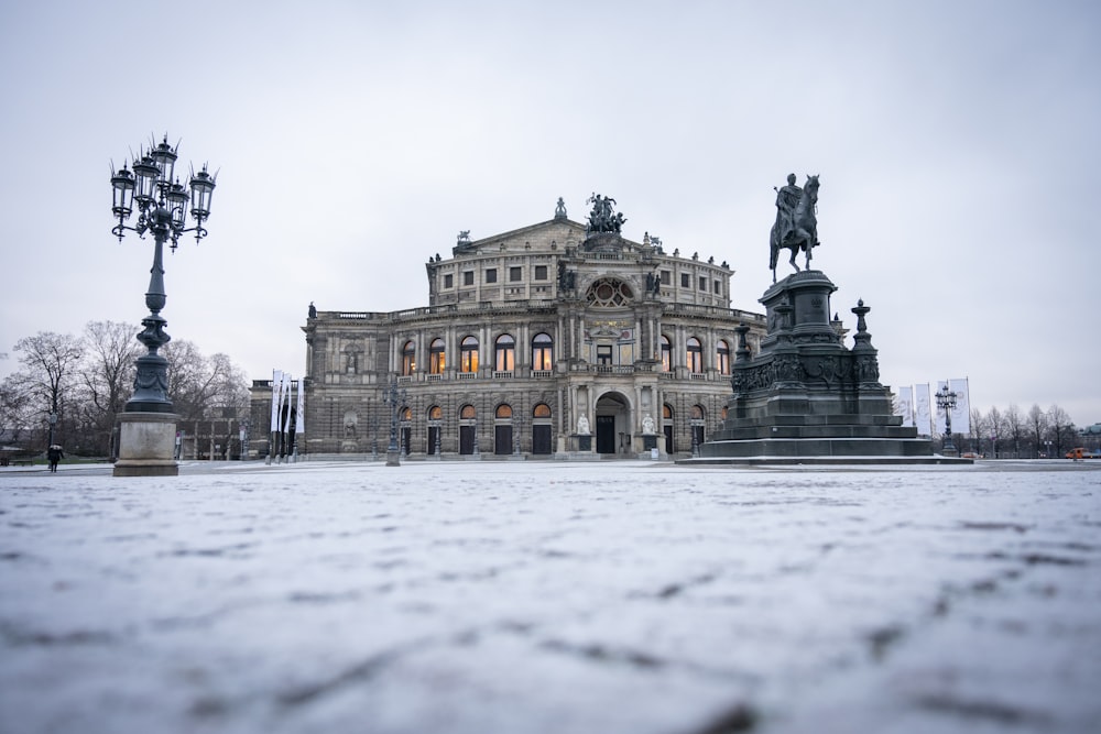 a large building with statues in front of it