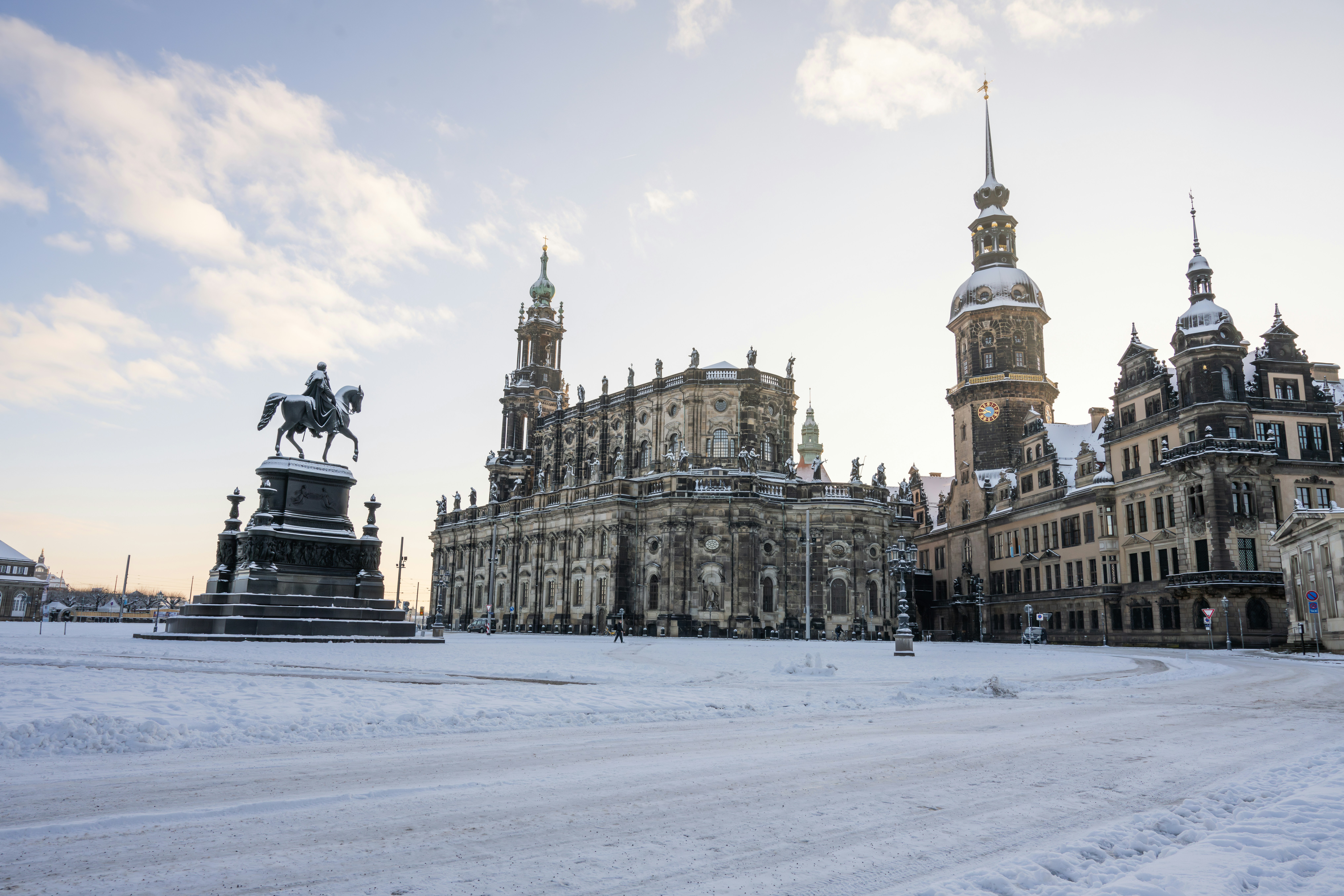 a large building with a statue in front of it