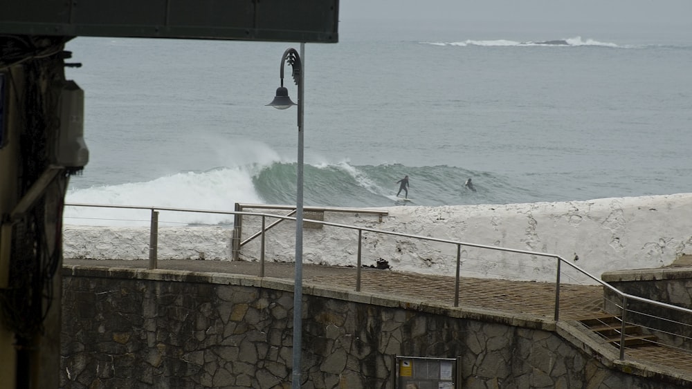 a person riding a surfboard on a wave in the ocean