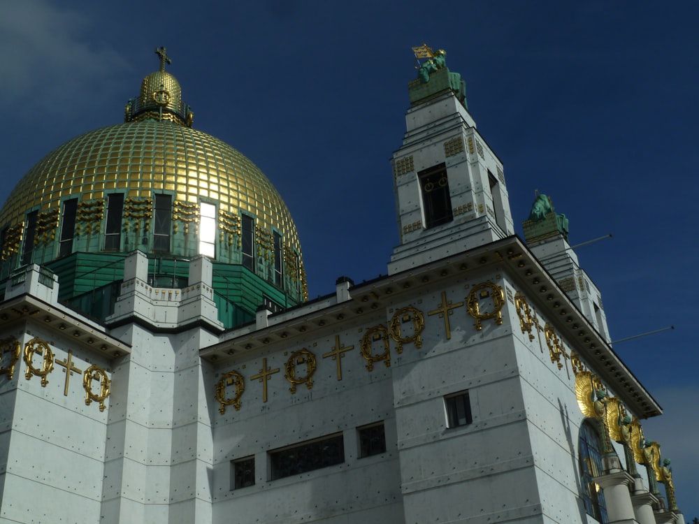 a large white building with a gold dome on top