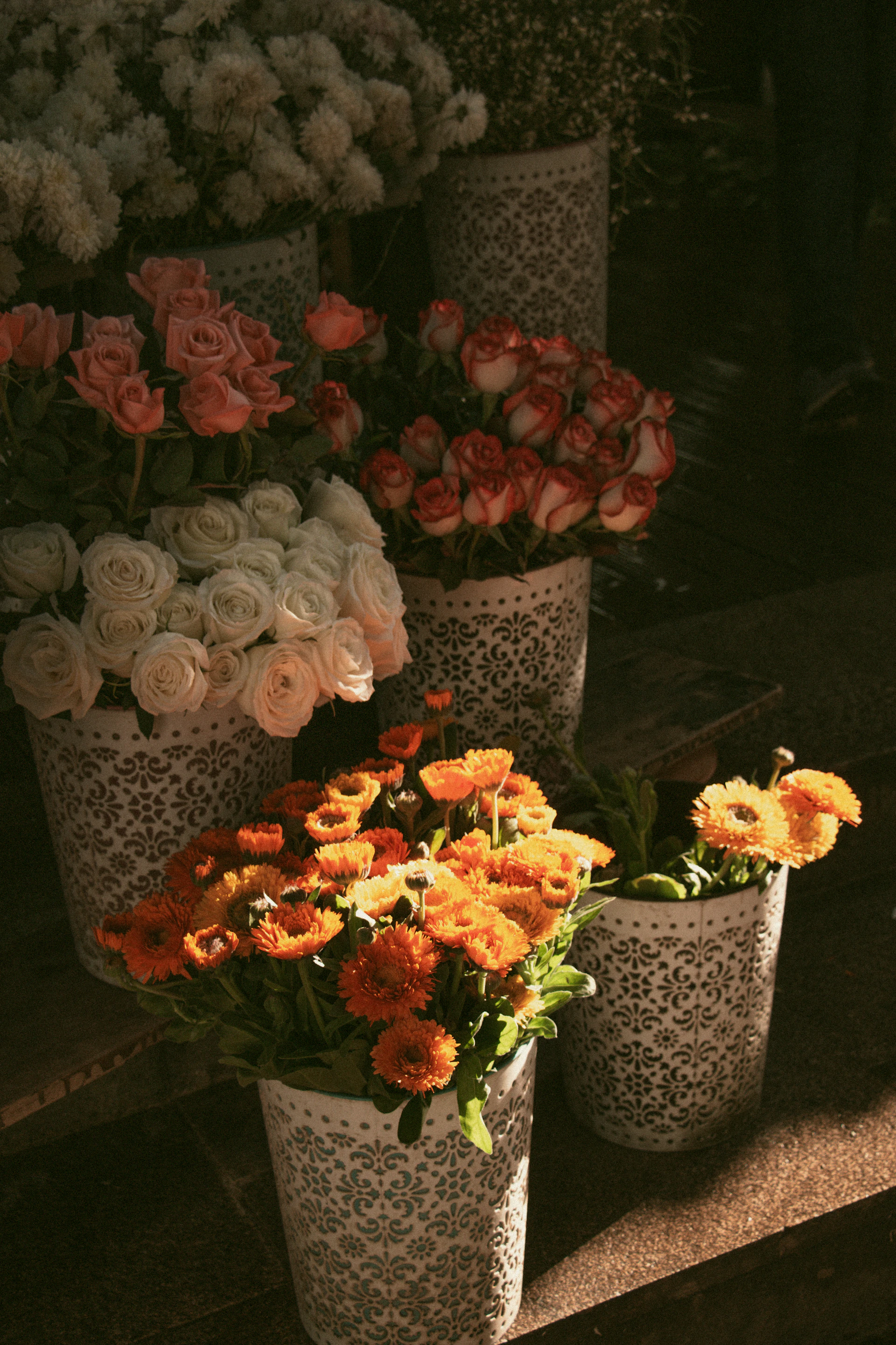 a bunch of flowers that are sitting in vases