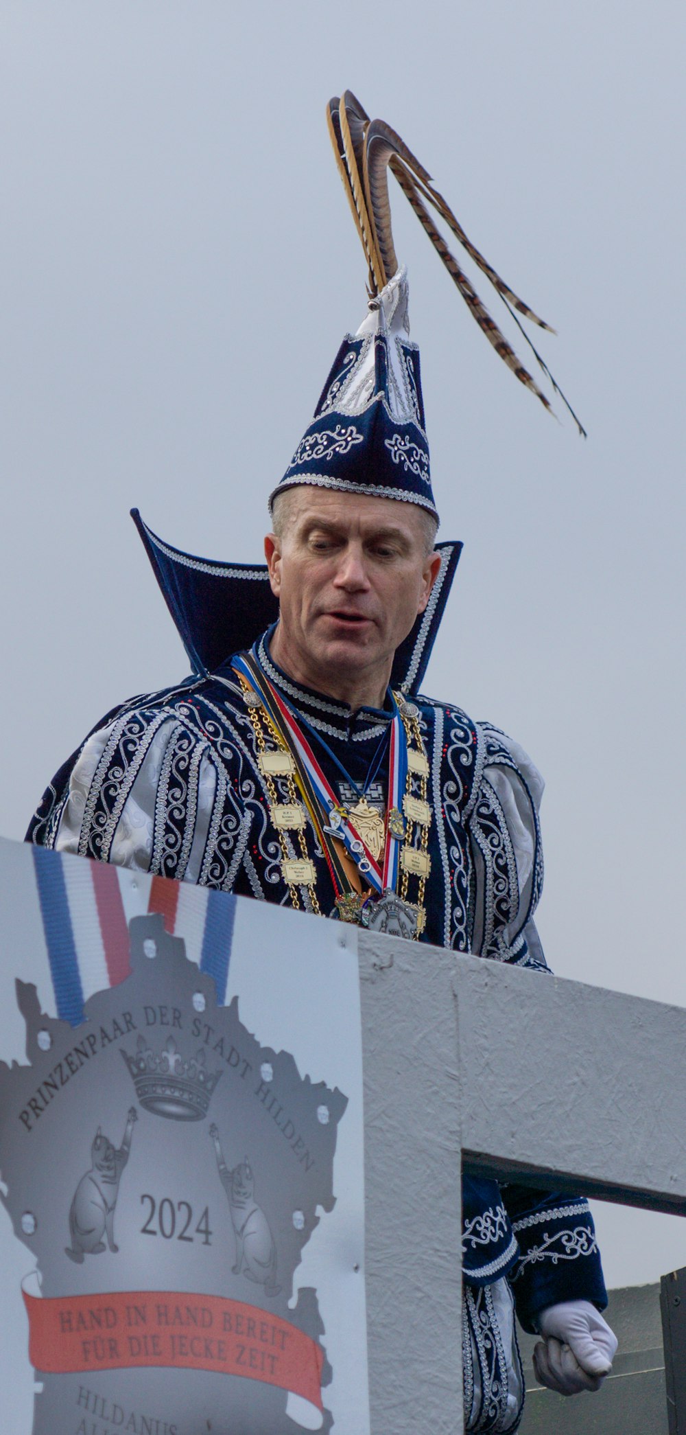 a man in a costume standing on a stage