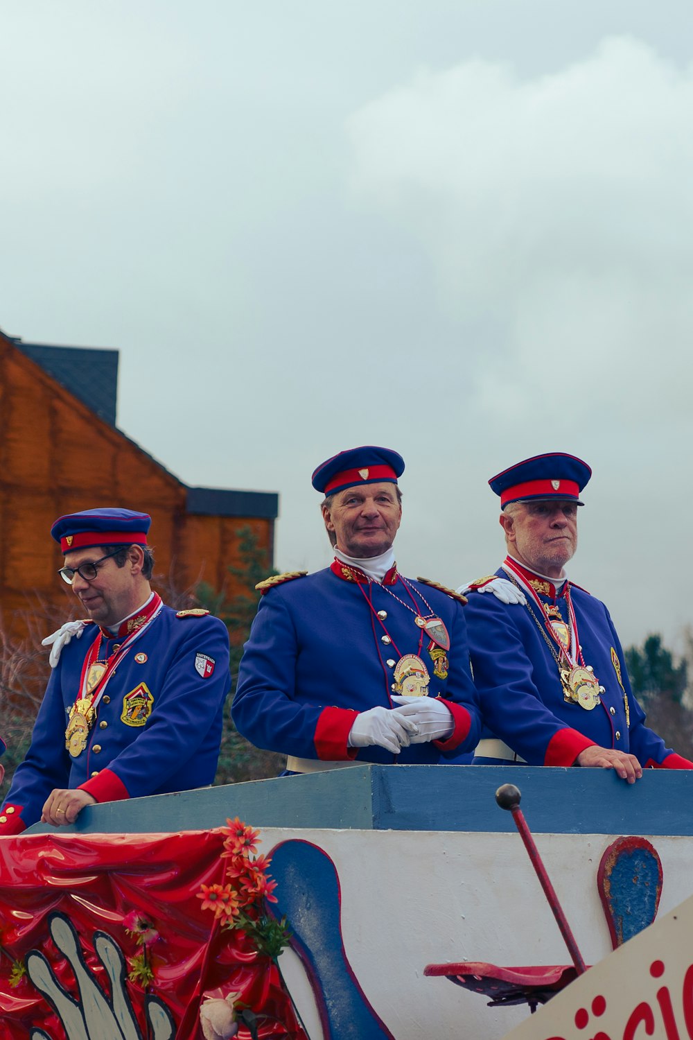 a group of men riding on the back of a float