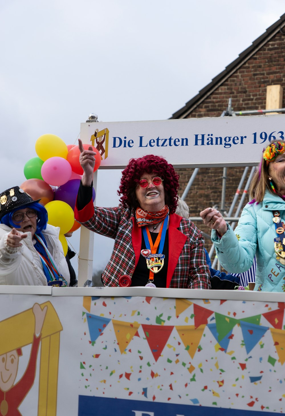 a group of people standing on top of a float