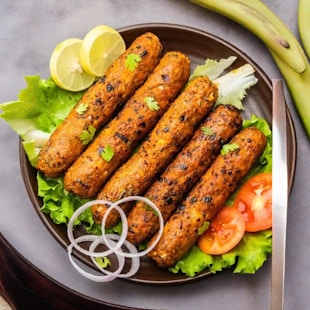 a plate of food on a table with a knife and fork