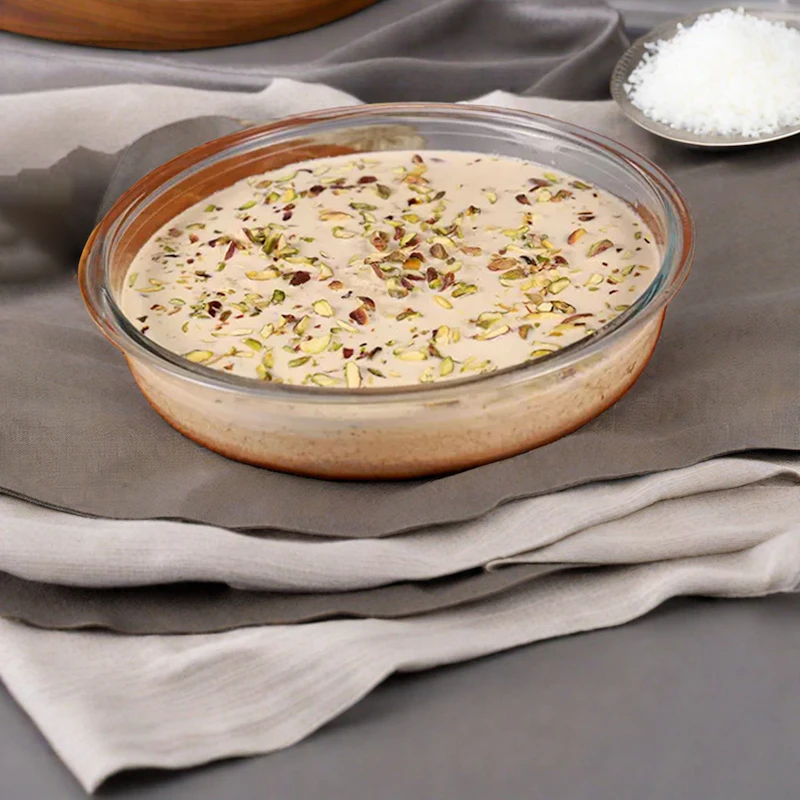 A bowl of thick, creamy basundi topped with nuts