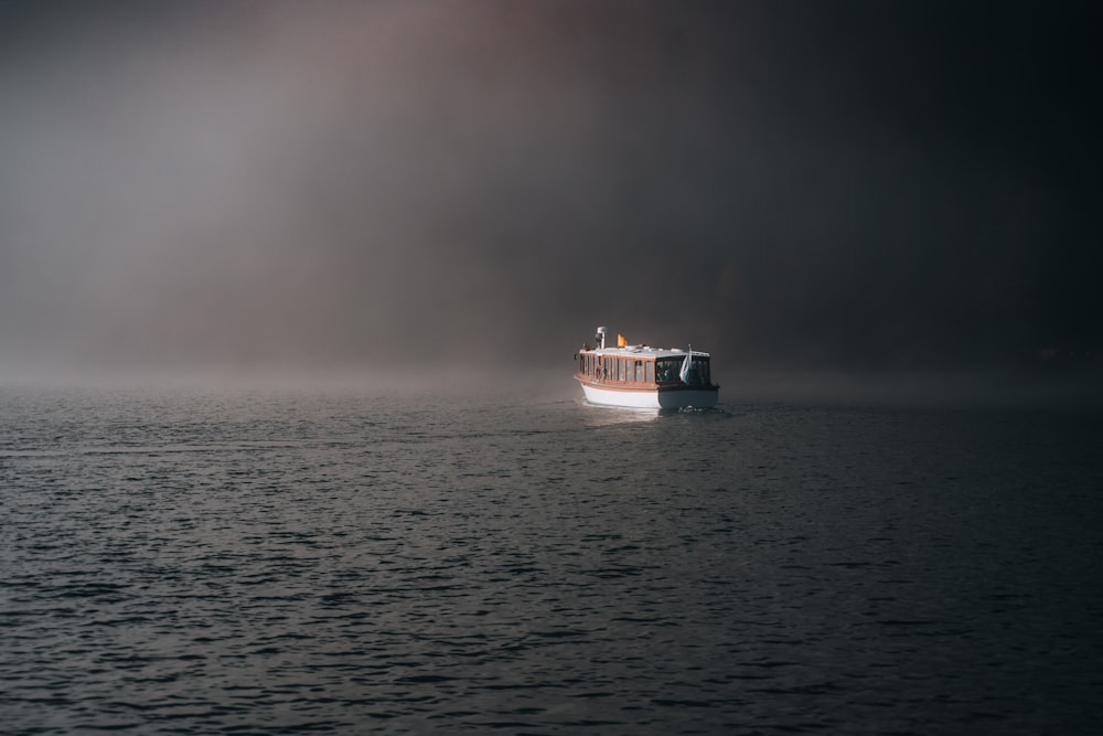 a boat floating on top of a large body of water