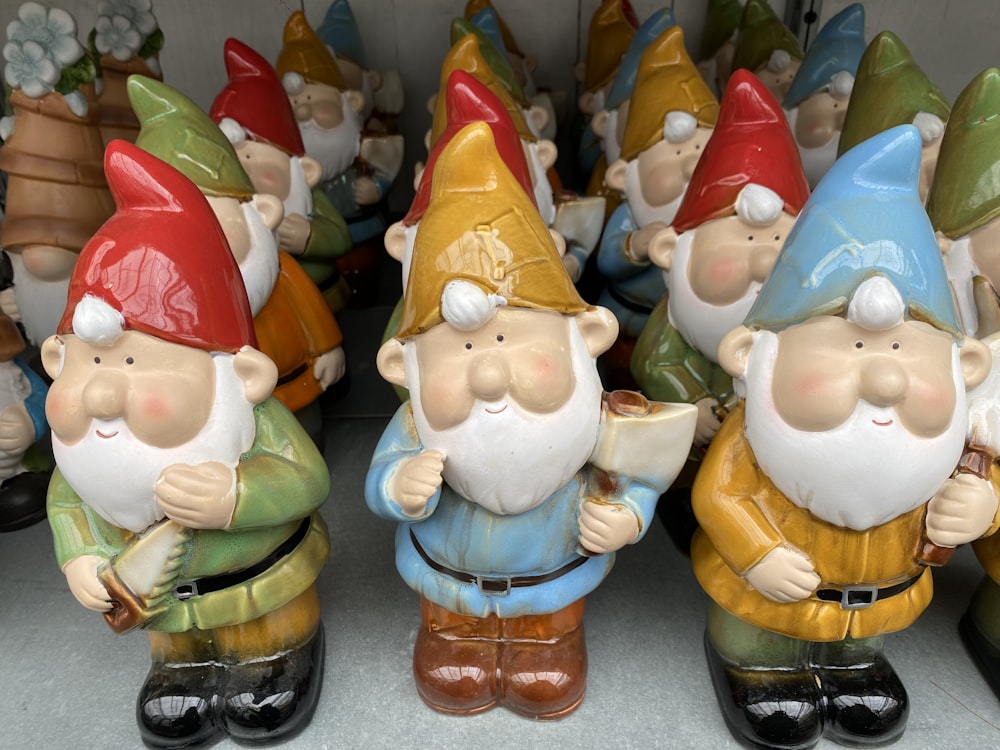 a group of gnome figurines sitting next to each other