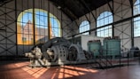 a large machine in a large building with big windows