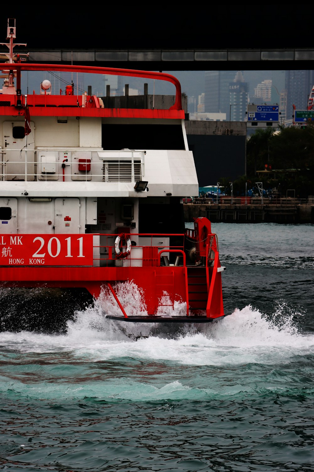 a large red and white boat in the water