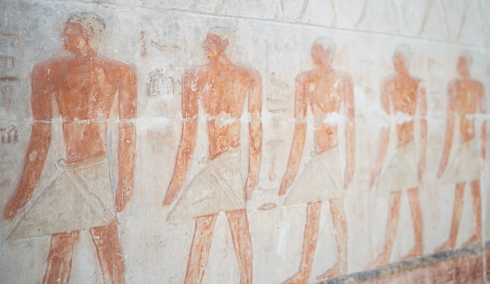 some ancient egyptian paintings on a wall