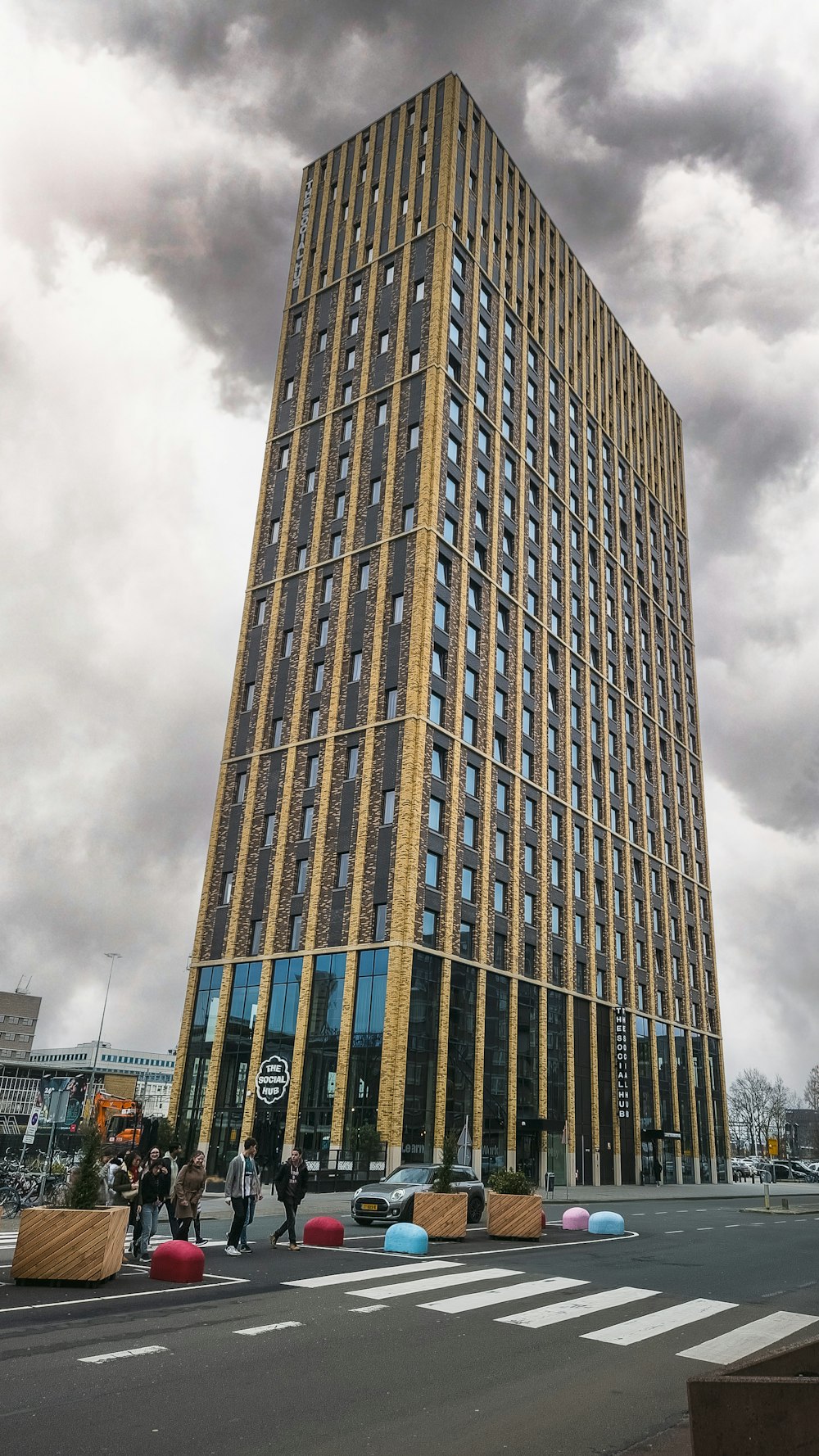 a very tall building sitting on the side of a road