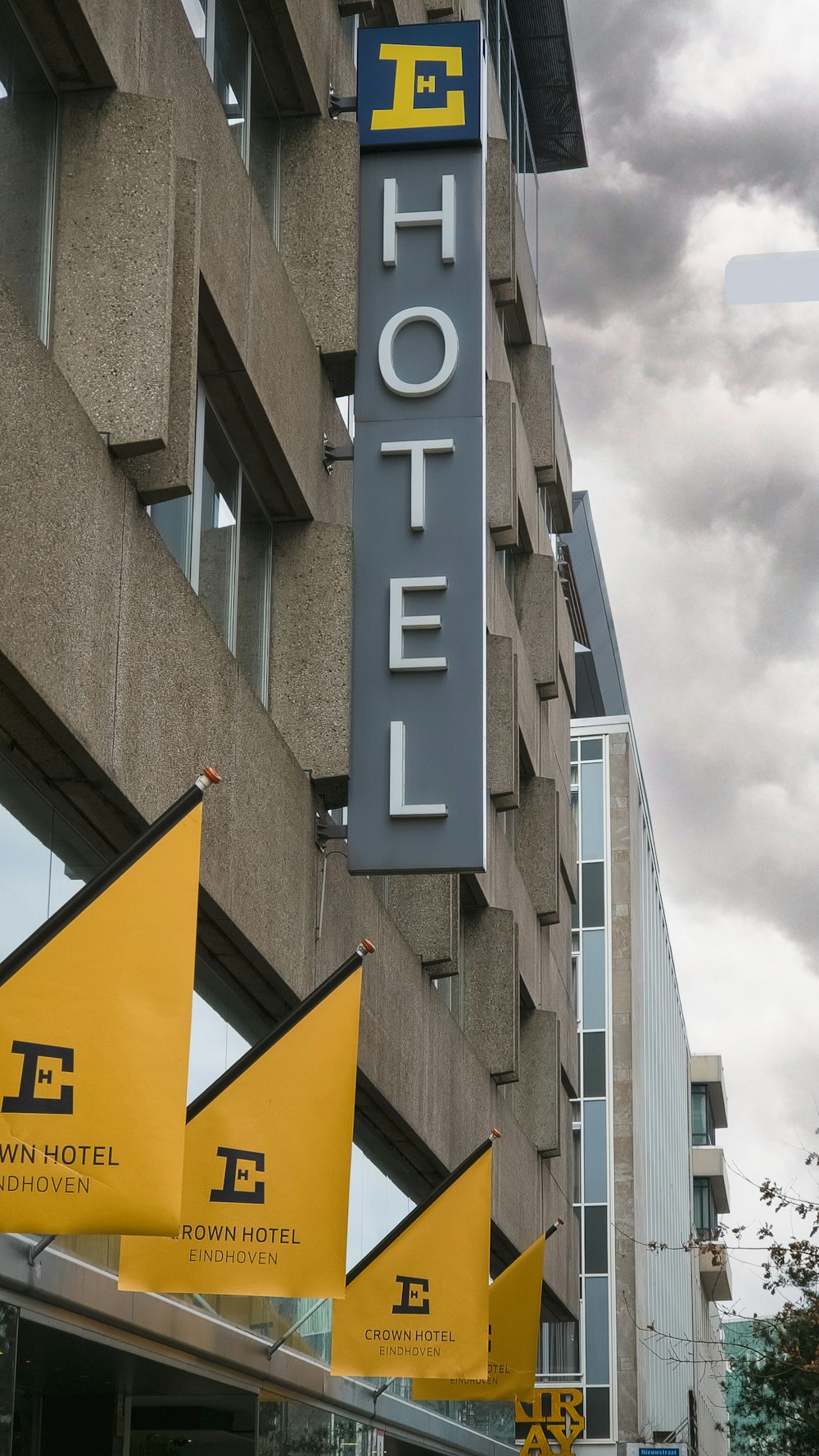 a hotel sign hanging off the side of a building