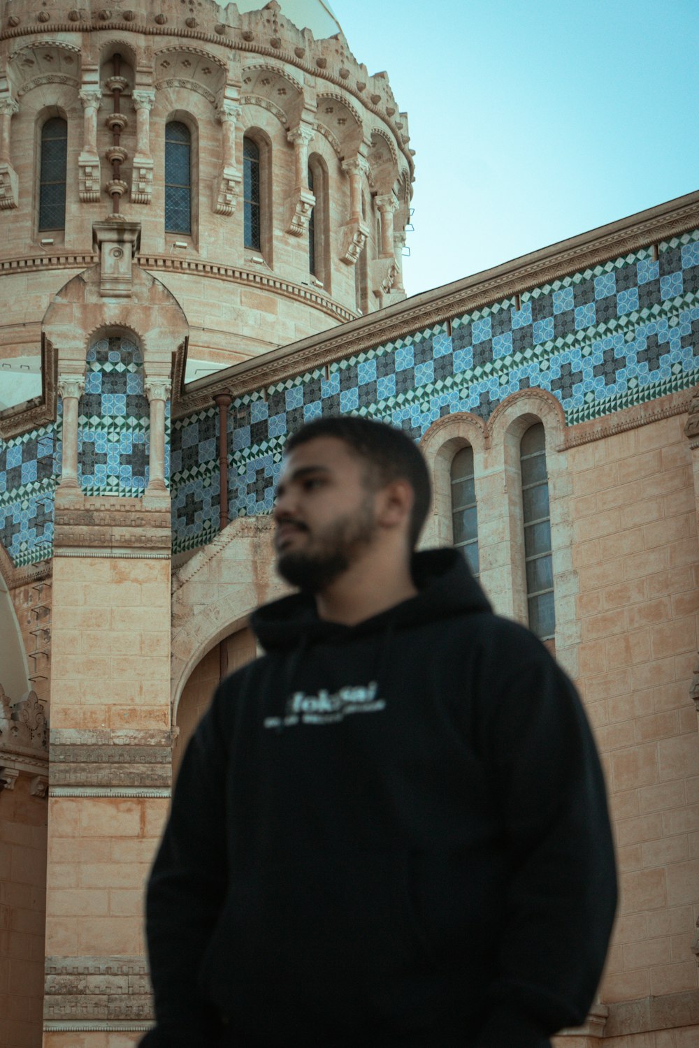 a man is standing in front of a building