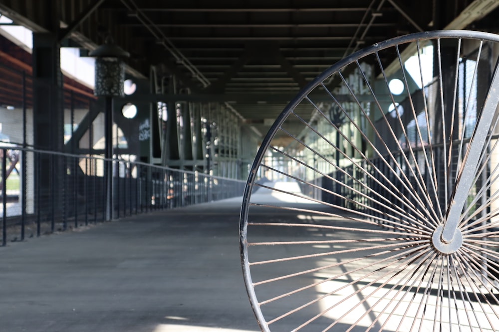 a close up of a bicycle wheel on a sidewalk